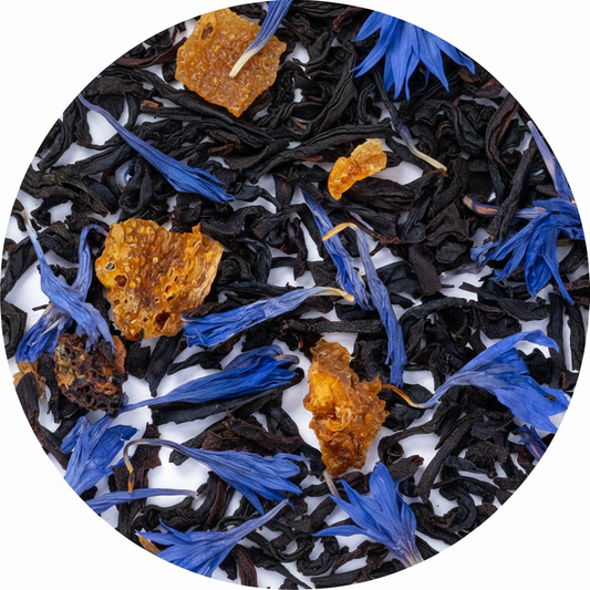 Close-up of black tea leaves with blue flowers and orange研学 on a white background